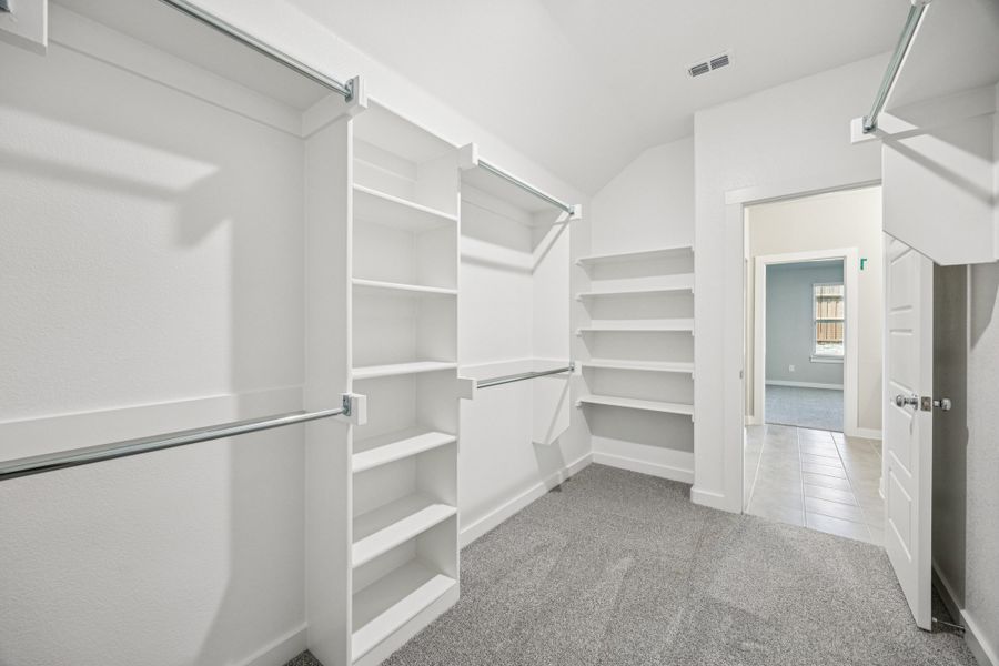 Primary Closet in the Oscar home plan by Trophy Signature Homes – REPRESENTATIVE PHOTO Primary Closet in the Oscar home plan by Trophy Signature Homes – REPRESENTATIVE PHOTO