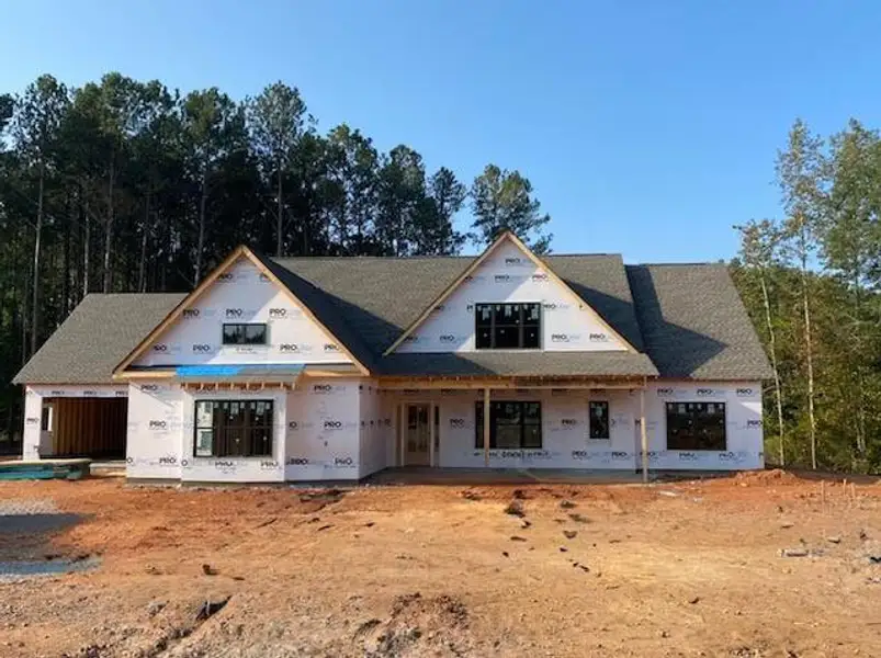 Front exterior of a new home in Stonegate, Monroe, GA, highlighting curb appeal (Image 1).