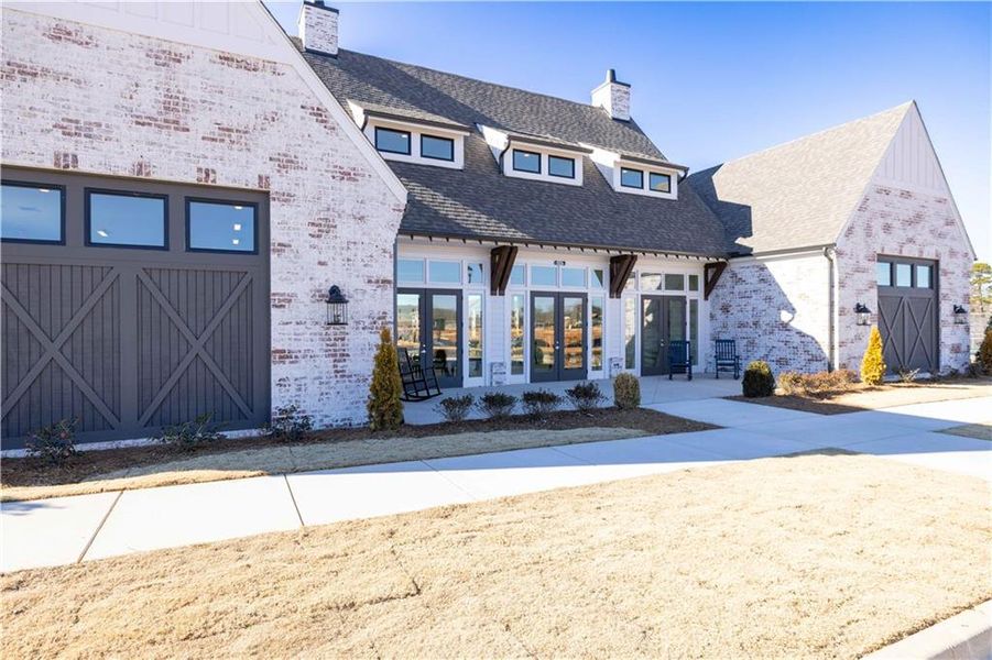 Front exterior of a new home in Promenade at Sawnee Village, Cumming, GA, highlighting curb appeal (Image 24).