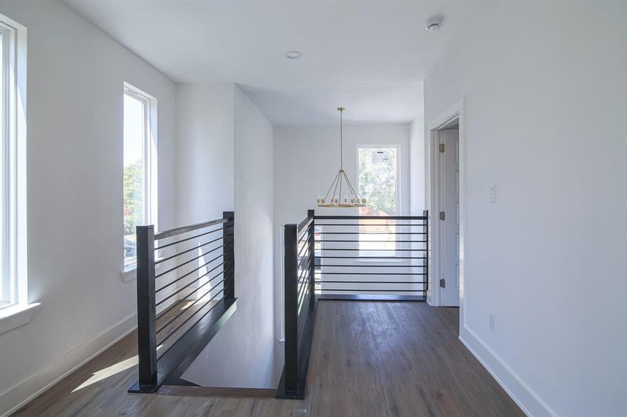 Hallway featuring dark hardwood / wood-style flooring