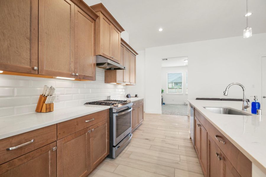 You will love the details of this kitchen! It features under cabinet lighting, modern tile backsplash, quartz countertops, and stainless steel hardware. You will love the details of this kitchen! It features under cabinet lighting, modern tile backsplash, quartz countertops, and stainless steel hardware.
