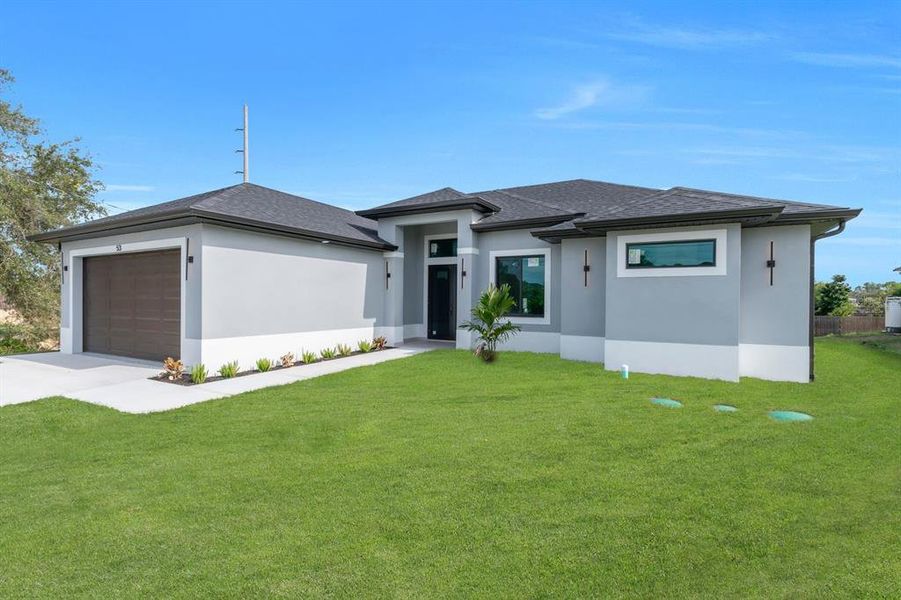 Front exterior of a new home in , Lehigh Acres, FL, highlighting curb appeal (Image 20).