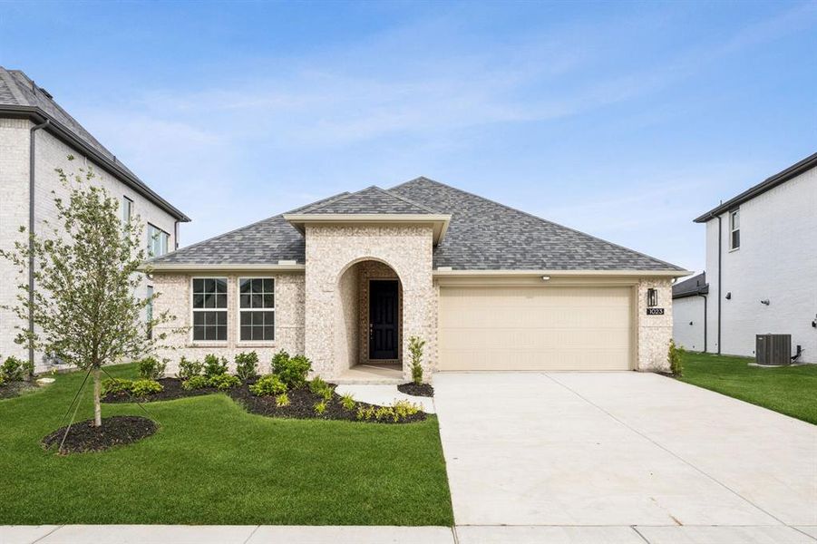 Front exterior of a new home in Bellagio, Forney, TX, highlighting curb appeal (Image 2).