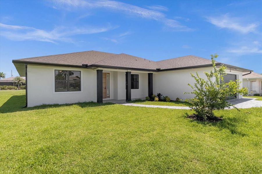 Front exterior of a new home in , Rotonda West, FL, highlighting curb appeal (Image 18).