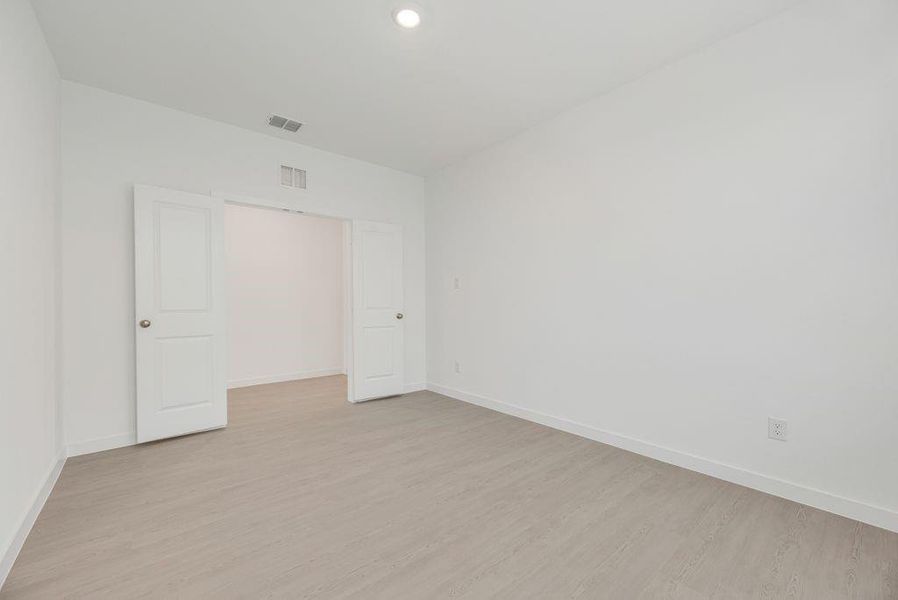 Unfurnished bedroom featuring light wood-type flooring and recessed lighting Unfurnished bedroom featuring light wood-type flooring and recessed lighting