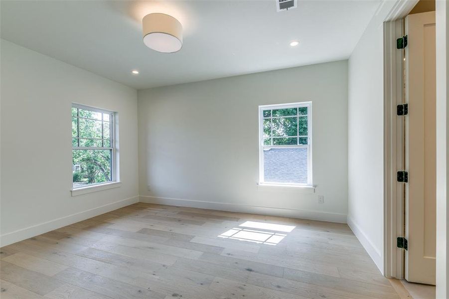 Empty room with light wood-type flooring