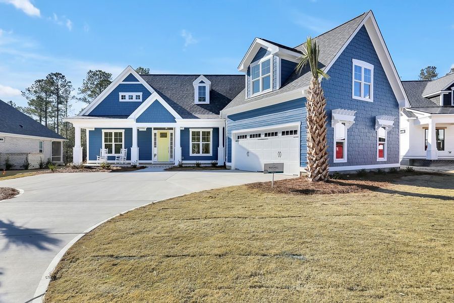 Front exterior of a new home in Compass Pointe, Leland, NC, highlighting curb appeal (Image 1). Front exterior of a new home in Compass Pointe, Leland, NC, highlighting curb appeal (Image 1).