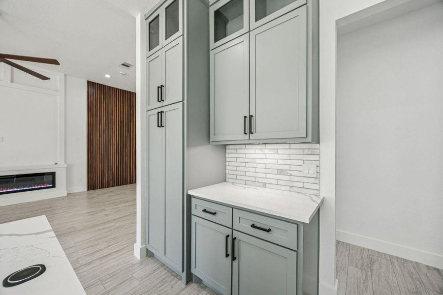 Perfect spot for your morning coffee set up or a fun bar! The large cabinets are a great space to hide kitchen appliances. Perfect spot for your morning coffee set up or a fun bar! The large cabinets are a great space to hide kitchen appliances.