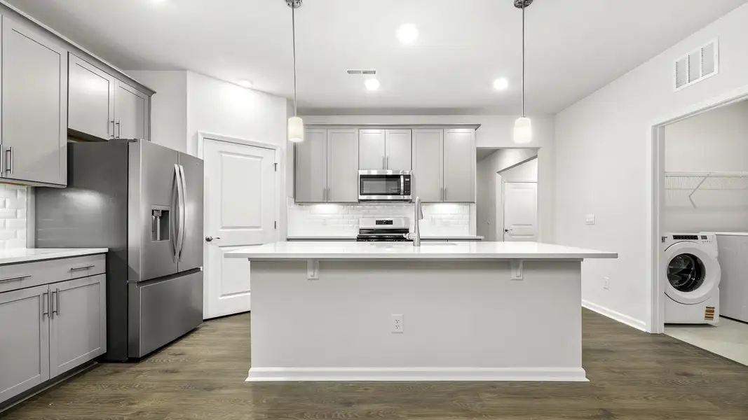 Furnished interior view inside a new home in The Villas at Kinsley, Jamestown (Image 3).