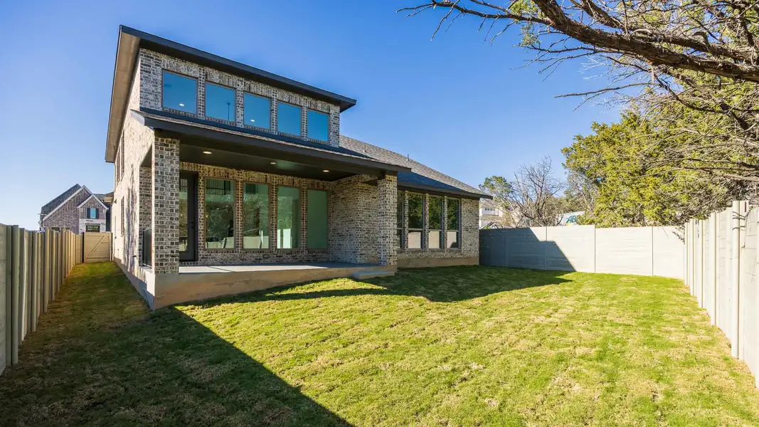 Exterior details and patio area of a home in Wolf Ranch 51', Georgetown (Image 2).