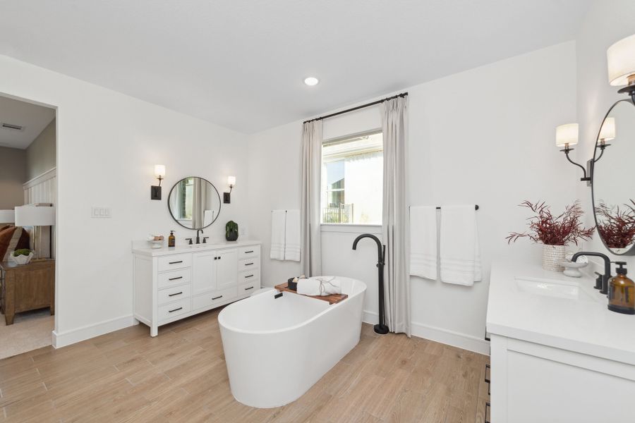 Primary bath with freestanding tub and dual vanities Primary bath with freestanding tub and dual vanities