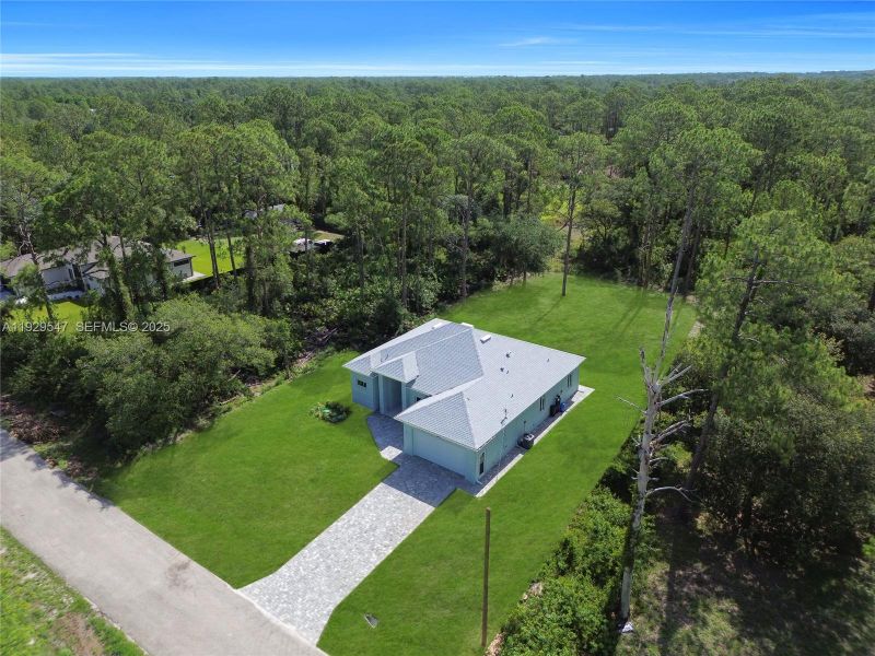Front exterior of a new home in , Lehigh Acres, FL, highlighting curb appeal (Image 2). Front exterior of a new home in , Lehigh Acres, FL, highlighting curb appeal (Image 2).