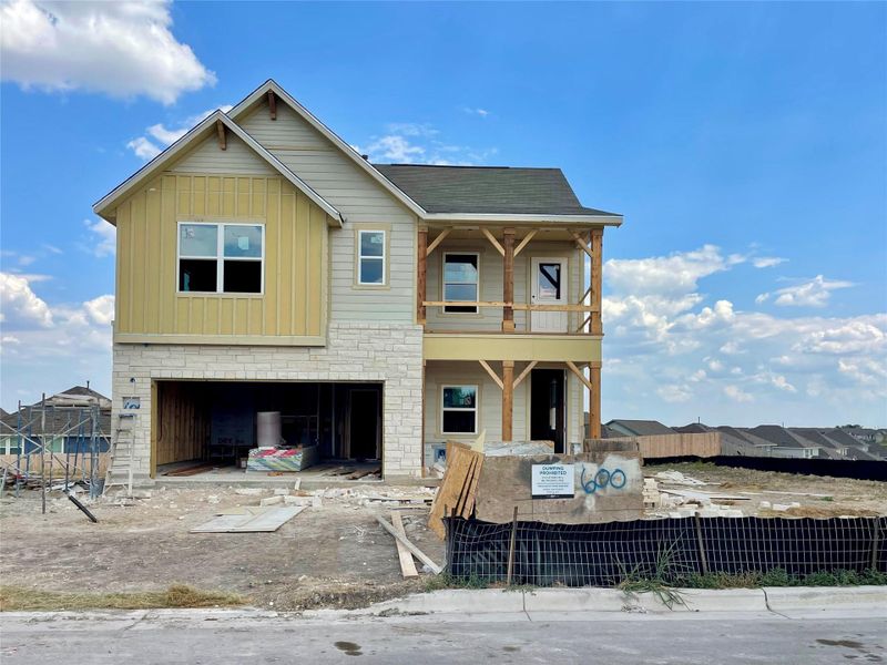 Front exterior of a new home in Covered Bridge, Hutto, TX, highlighting curb appeal (Image 2).