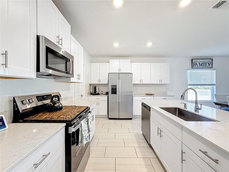 Furnished interior view inside a new home in Berry Bay: The Executives, Wimauma (Image 11).
