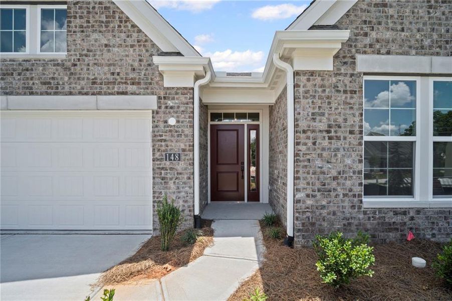 Front exterior of a new home in Laurel Farms, Dallas, GA, highlighting curb appeal (Image 23).