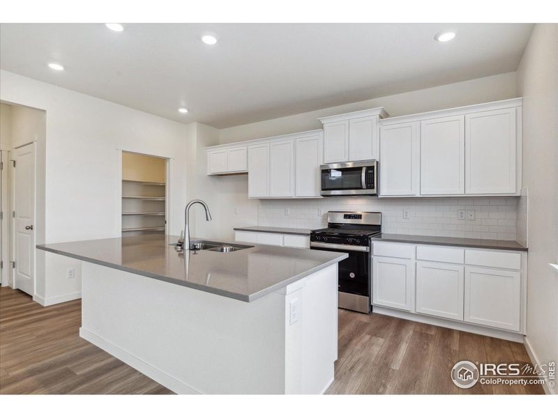 Furnished interior view inside a new home in Silver Peaks, Lochbuie (Image 9).