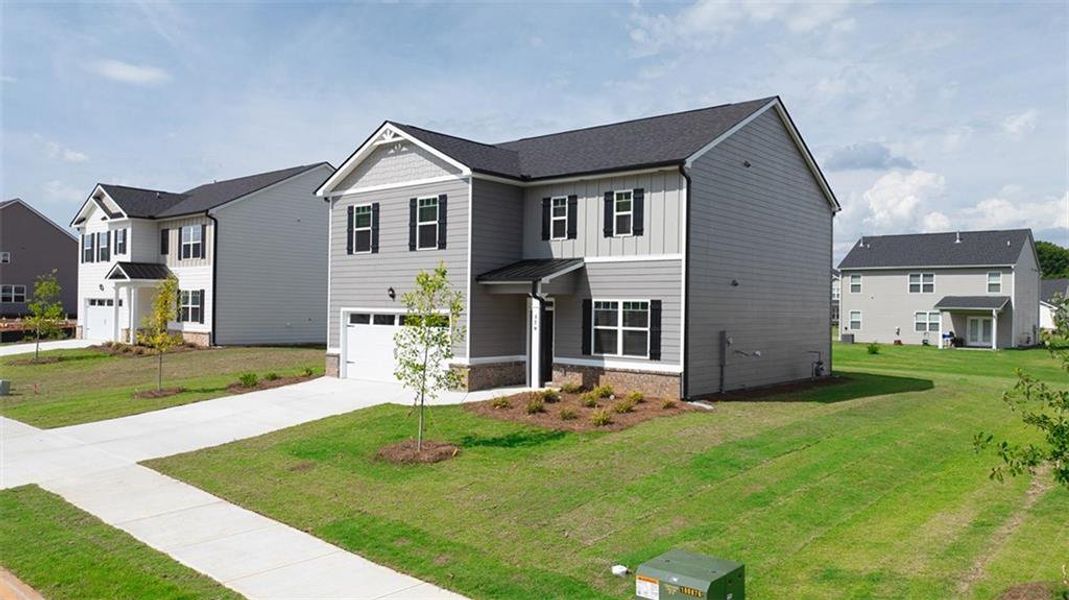 Front exterior of a new home in Jackson Landing, Jefferson, GA, highlighting curb appeal (Image 2).