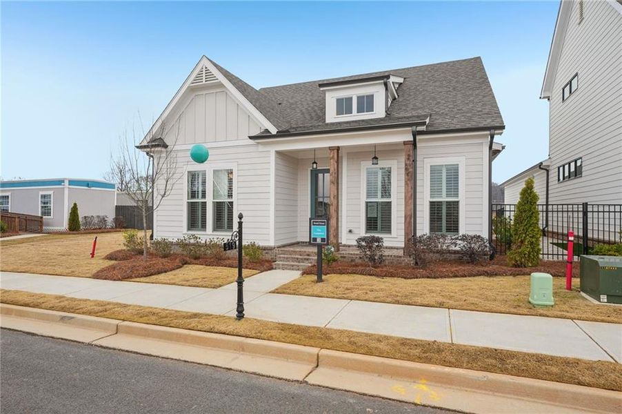 Front exterior of a new home in Promenade at Sawnee Village, Cumming, GA, highlighting curb appeal (Image 21).