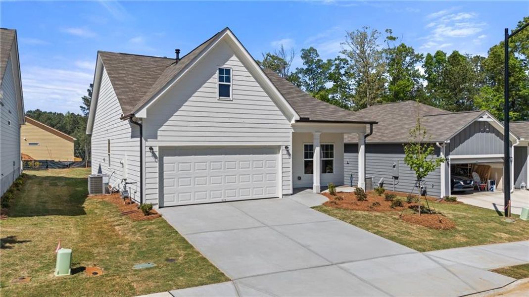 Front exterior of a new home in Villages at Cedar Hill, Dallas, GA, highlighting curb appeal (Image 16).