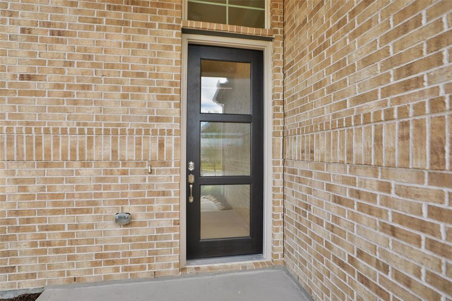 Exterior details and patio area of a home in Sunterra, Katy (Image 2). Exterior details and patio area of a home in Sunterra, Katy (Image 2).