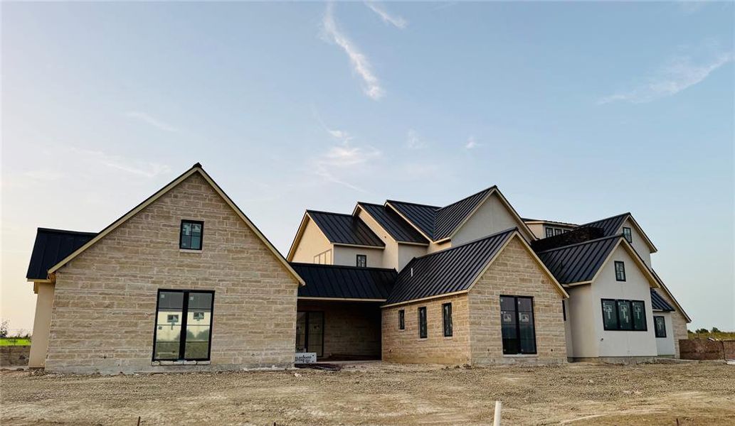 Covered breeze way from one of the two oversized garages!