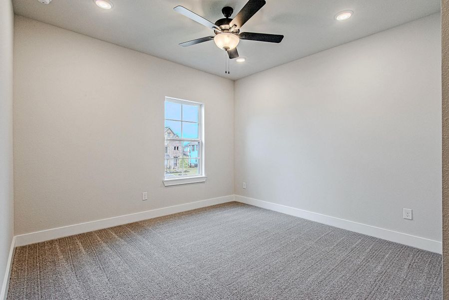 Bright bedroom with neutral palette, ready for personalization.
