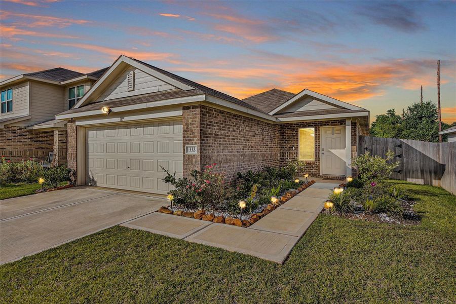 Front exterior of a new home in , Sealy, TX, highlighting curb appeal (Image 24). Front exterior of a new home in , Sealy, TX, highlighting curb appeal (Image 24).