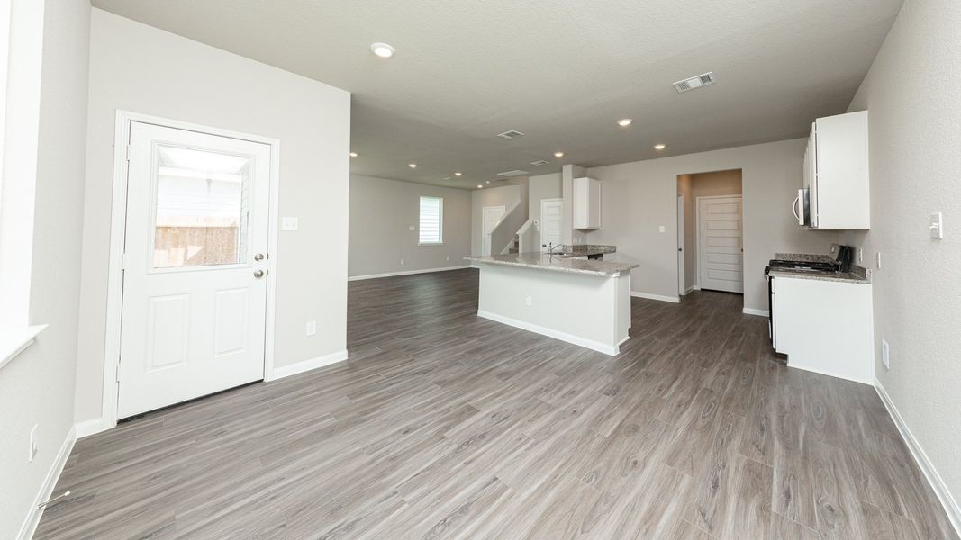 Dining Area to Kitchen and Family Room Dining Area to Kitchen and Family Room