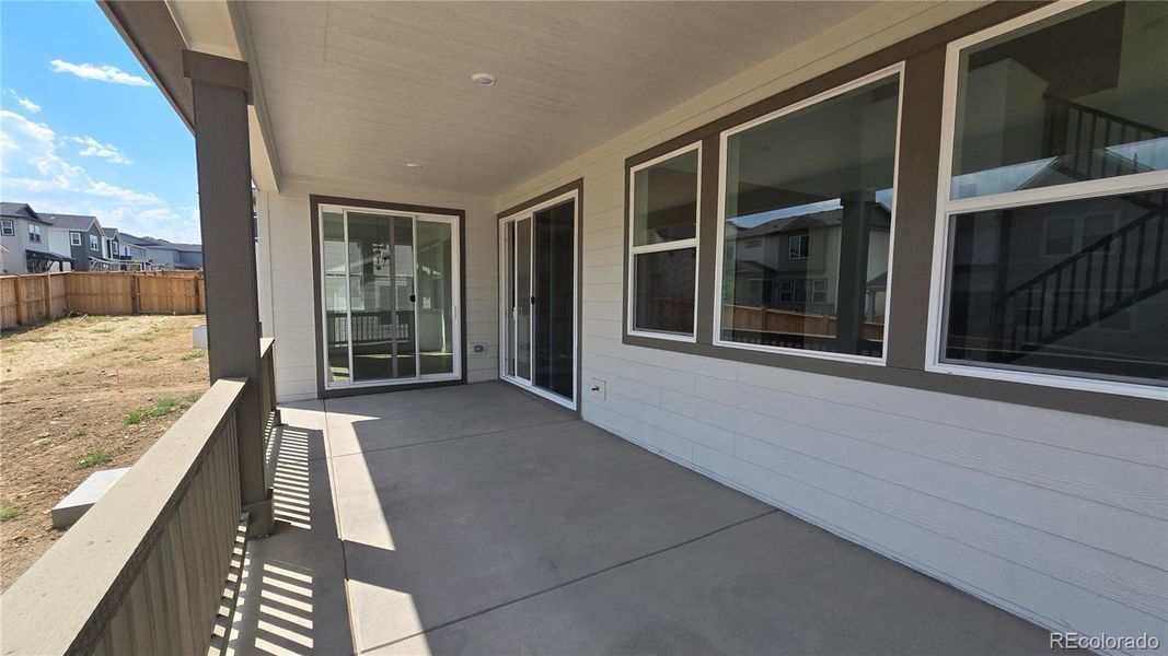 Front exterior of a new home in Trailstone City Collection, Arvada, CO, highlighting curb appeal (Image 2).