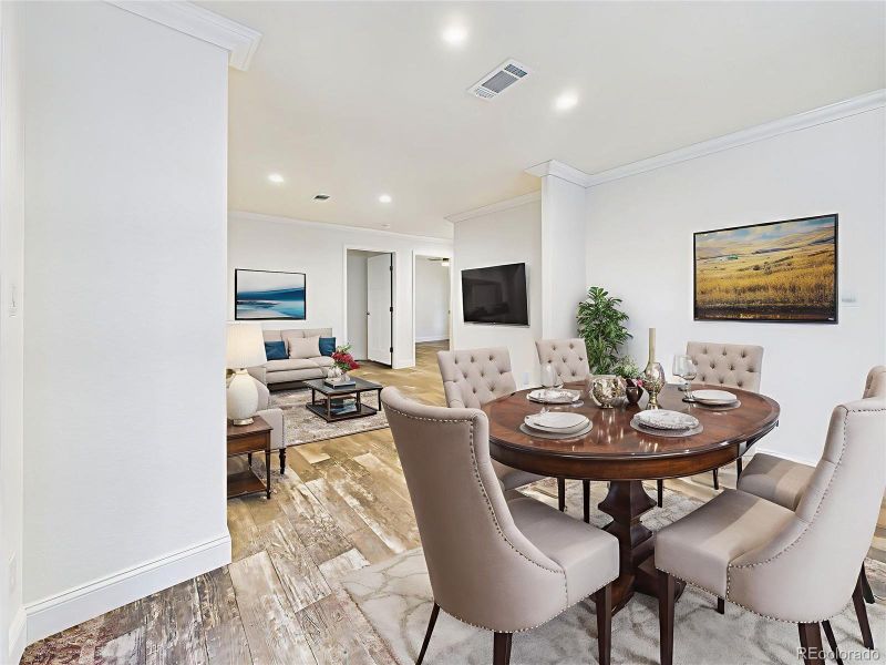 Virtually Staged to demonstrate flow between formal dining and relaxed living spaces.