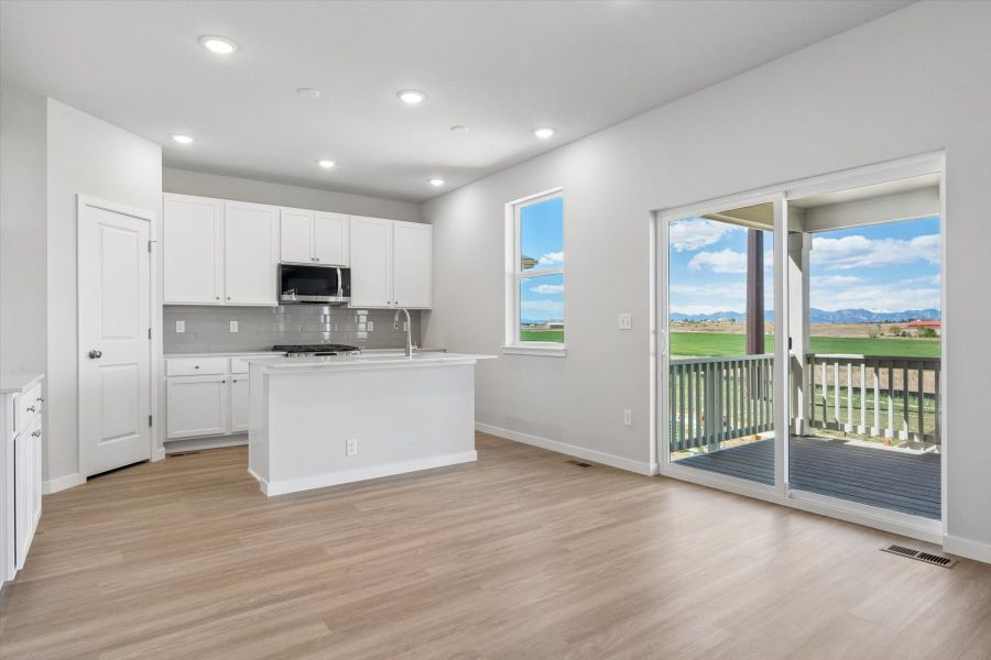 A kitchen with white cabinets. A kitchen with white cabinets.