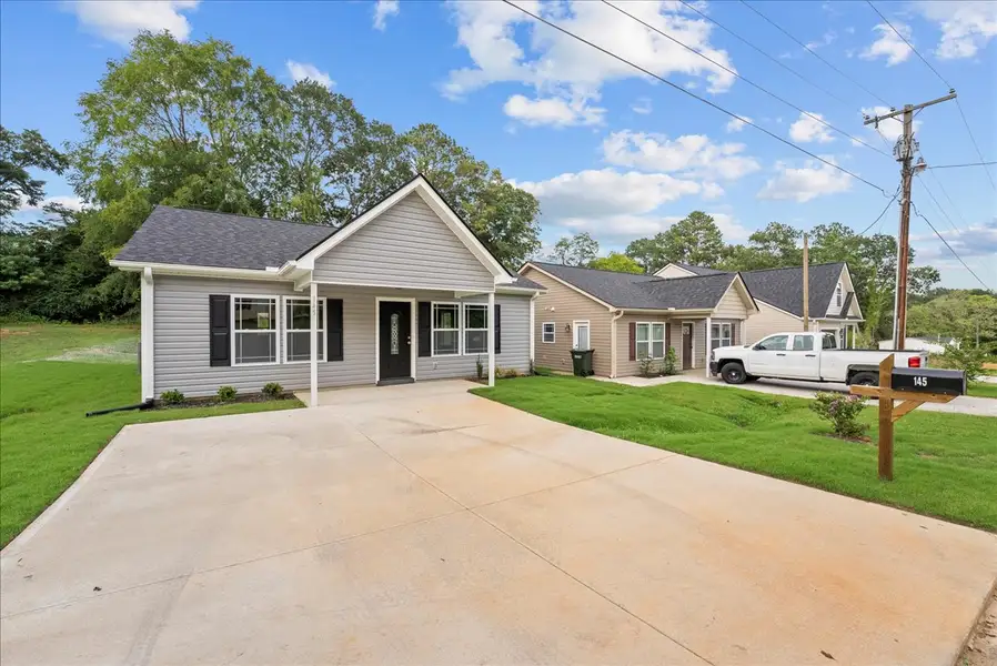 Representative exterior photo of a completed home built from the Lyman by Enchanted Homes in Lonesome Dove, San Antonio, TX (Image 22).