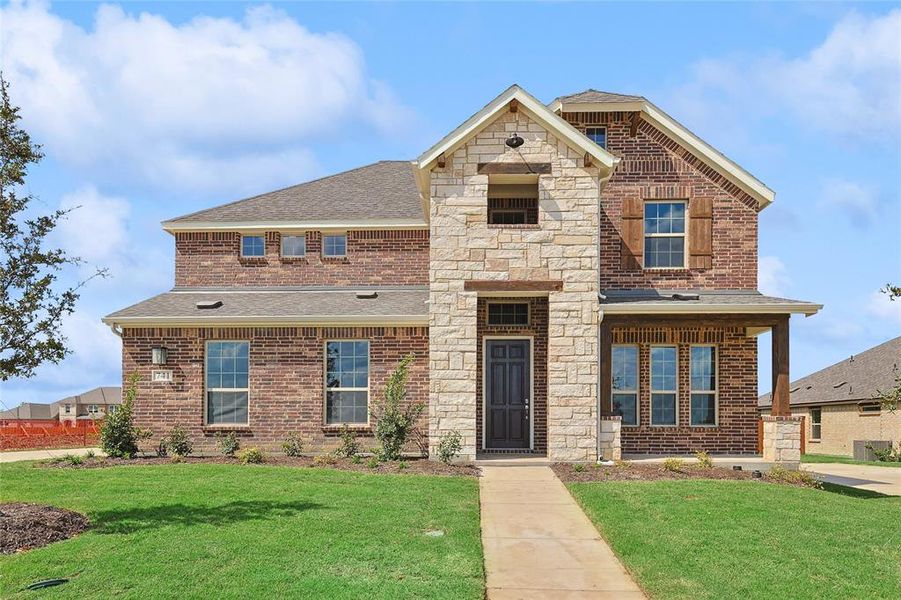 View of front of home featuring a front lawn