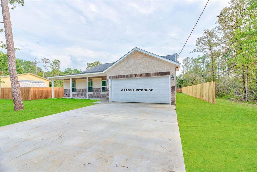 Front exterior of a new home in , Onalaska, TX, highlighting curb appeal (Image 1). Front exterior of a new home in , Onalaska, TX, highlighting curb appeal (Image 1).