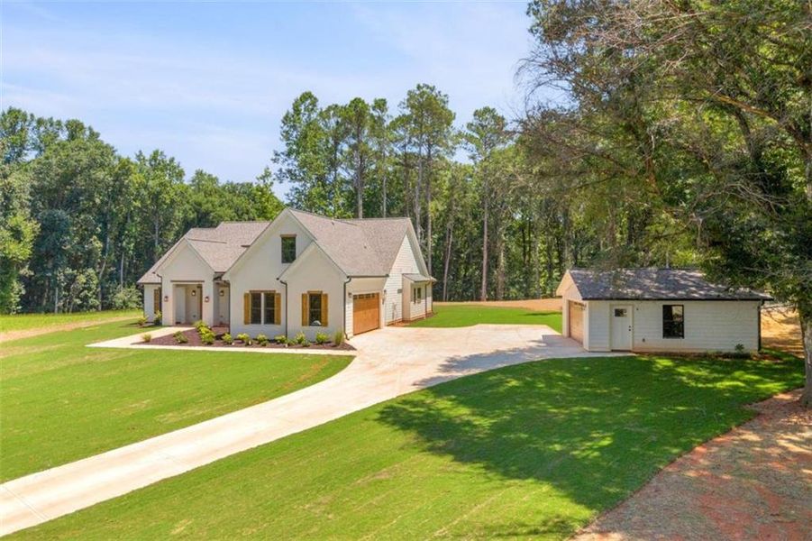 Front exterior of a new home in , Monroe, GA, highlighting curb appeal (Image 26). Front exterior of a new home in , Monroe, GA, highlighting curb appeal (Image 26).