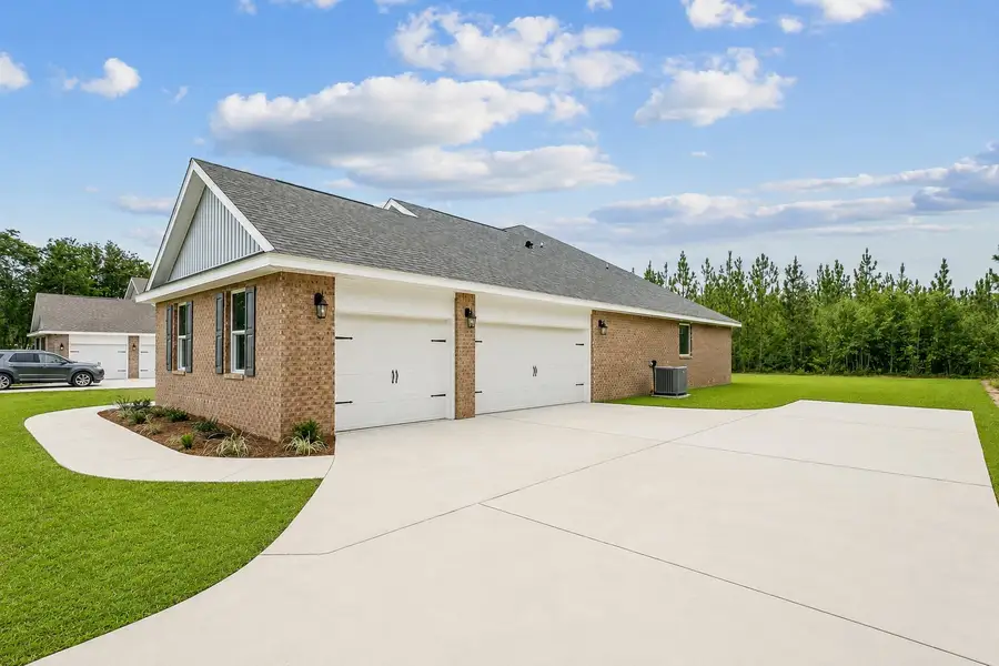 Representative exterior photo of a completed home built from the The Liberty Estate by Herbst Homes in Prosperity Point, Milton, FL (Image 25).