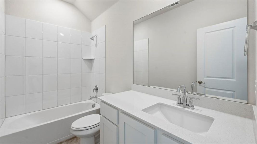 Bathroom featuring washtub / shower combination and vanity Bathroom featuring washtub / shower combination and vanity