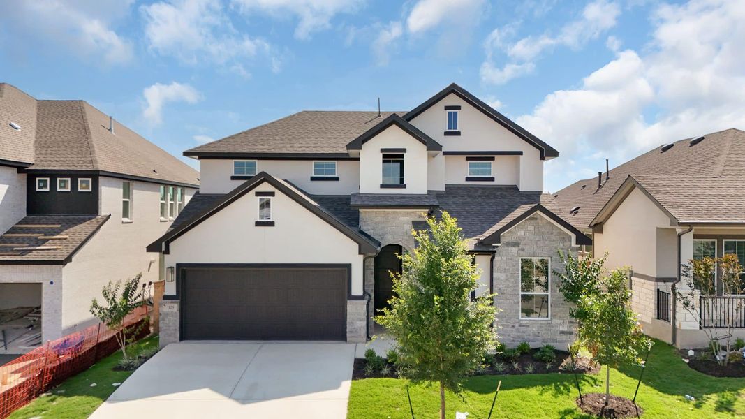 Front exterior of a new home in Nolina, Georgetown, TX, highlighting curb appeal (Image 26). Front exterior of a new home in Nolina, Georgetown, TX, highlighting curb appeal (Image 26).
