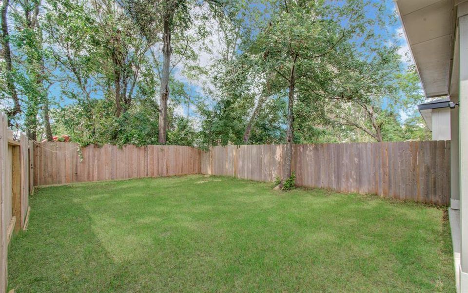 Amazing private backyard with covered patio! (photo from neighboring home)