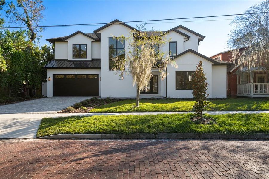 Front exterior of a new home in , Orlando, FL, highlighting curb appeal (Image 26). Front exterior of a new home in , Orlando, FL, highlighting curb appeal (Image 26).