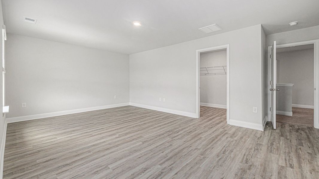 Spacious, unfurnished interior of a new home in The Preserve at Shaftesbury Glen, Conway (Image 8).