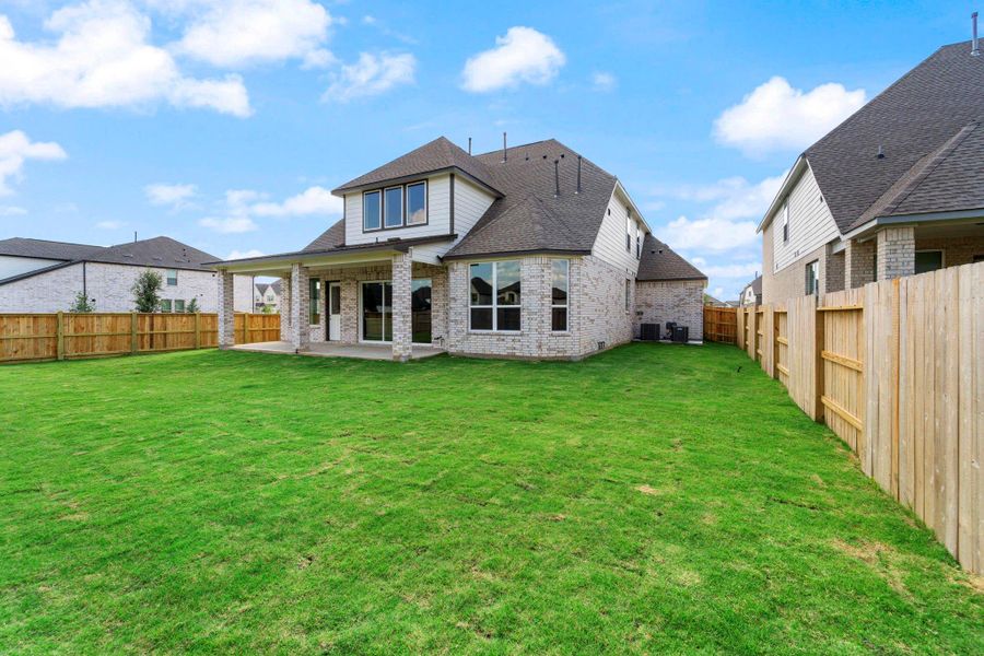 This backyard is perfect for family gatherings, social events, or simply unwinding in the fresh air. This backyard is perfect for family gatherings, social events, or simply unwinding in the fresh air.