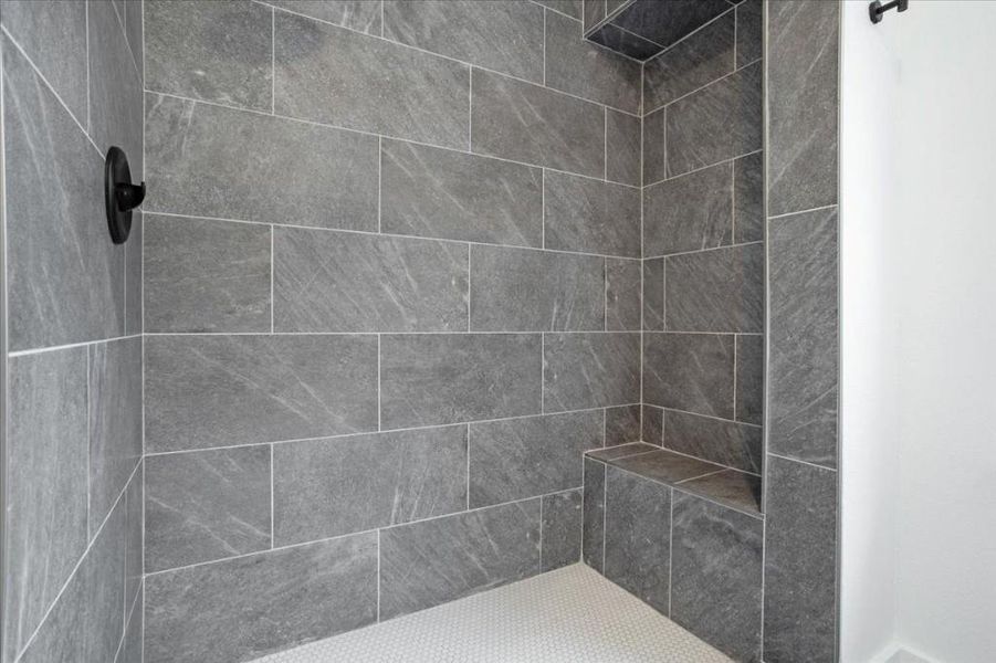 Bathroom with tiled shower