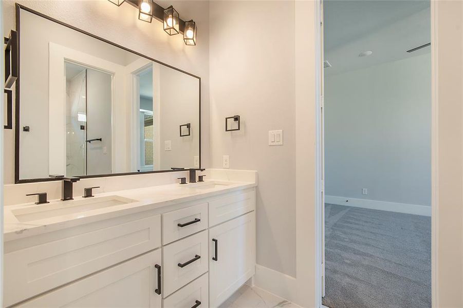 Full bathroom with double vanity and a shower with shower door Full bathroom with double vanity and a shower with shower door