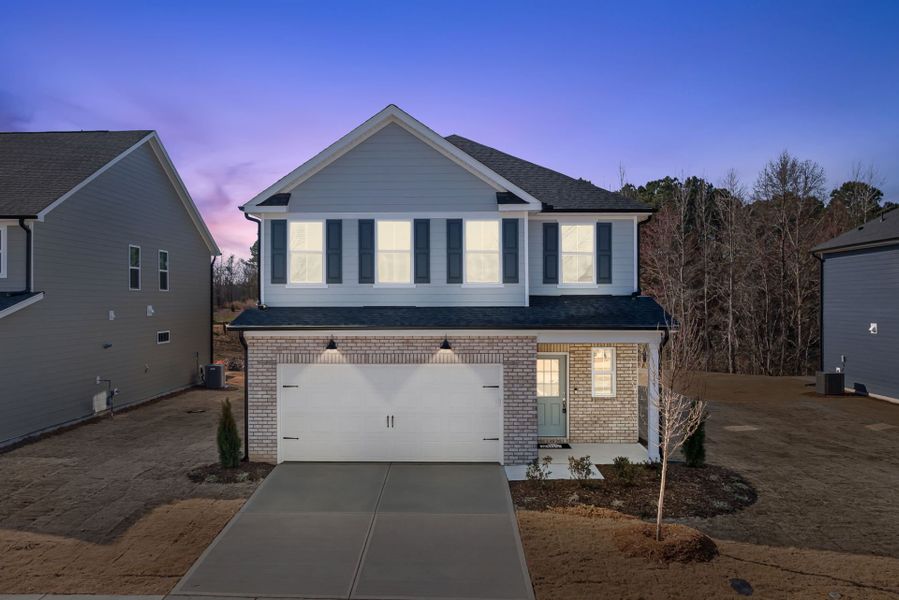 Front exterior of a new home in Providence Oaks, Fuquay Varina, NC, highlighting curb appeal (Image 29). Front exterior of a new home in Providence Oaks, Fuquay Varina, NC, highlighting curb appeal (Image 29).