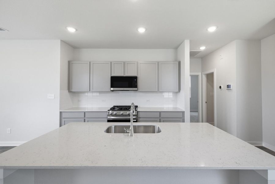 Furnished interior view inside a new home in Stallion Run, Buda (Image 8).
