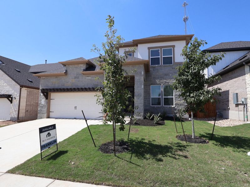 Front exterior of a new home in Edgewood, Leander, TX, highlighting curb appeal (Image 2).