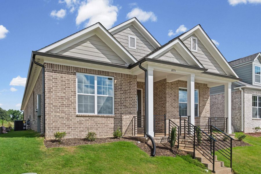 Brick facade with light gray siding accents Brick facade with light gray siding accents