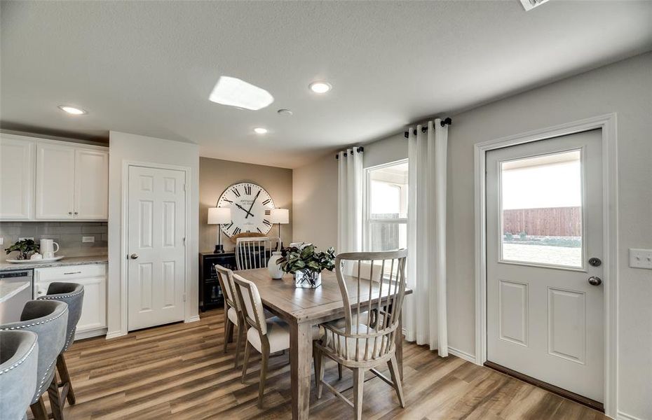 *Model Representation - Dining area off kitchen with large windows