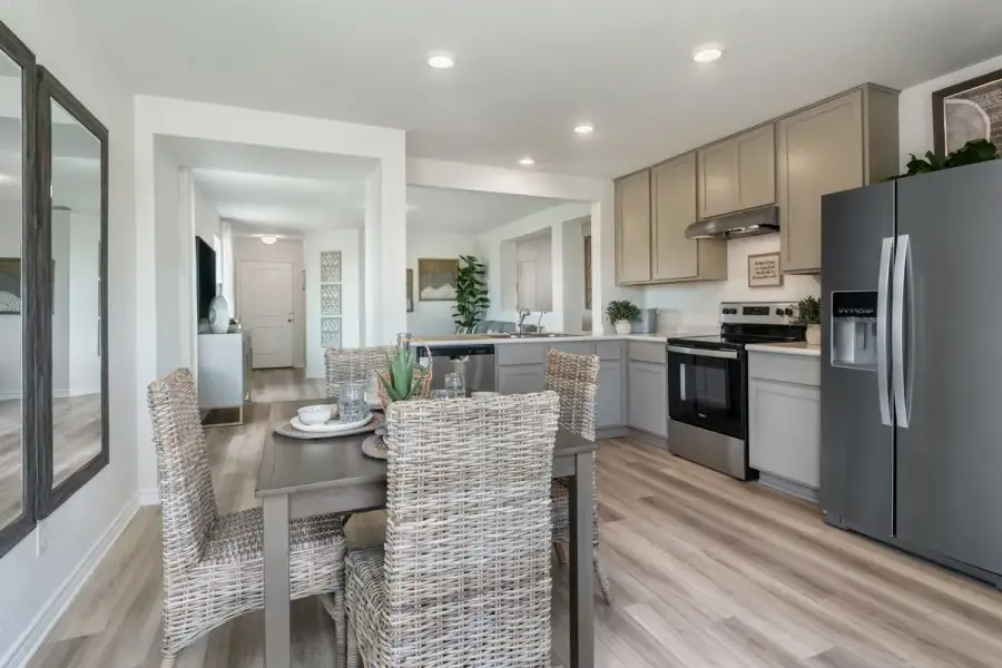 Representative furnished interior of a home built from the 1243 by KB Home in Espino, San Antonio (Image 5).
